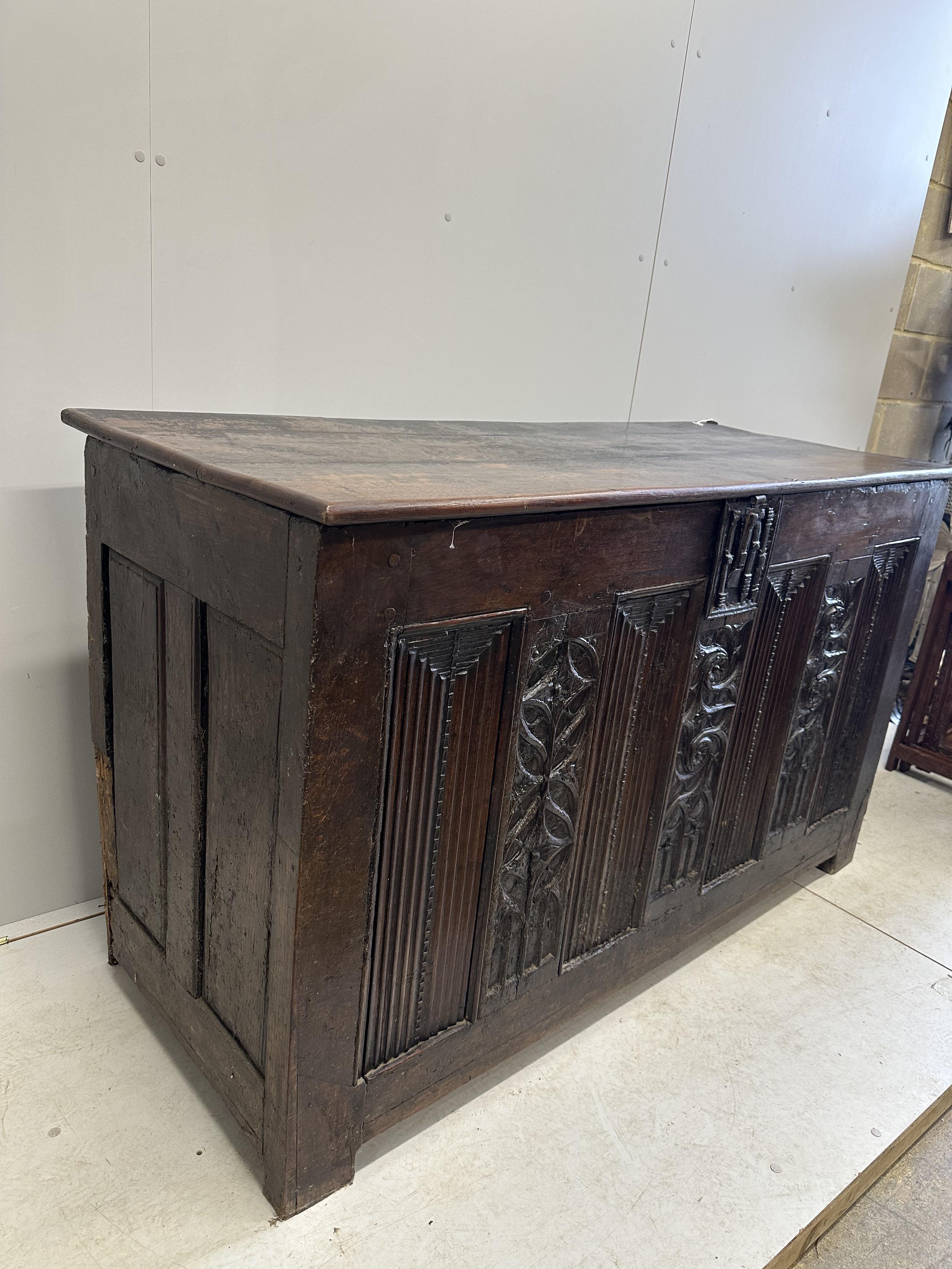 A 16th century French oak coffer, width 162cm, depth 66cm, height 96cm, top loose